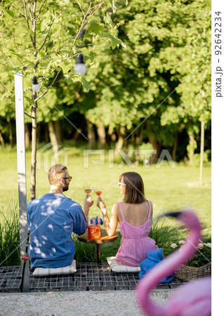 Young couple spend summer time with drink on nature 92642234