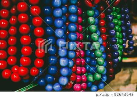Wooden red beads on the market Wooden red beads on the market 92643648