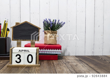April 30 calendar date text on white wooden block a table. 92643884