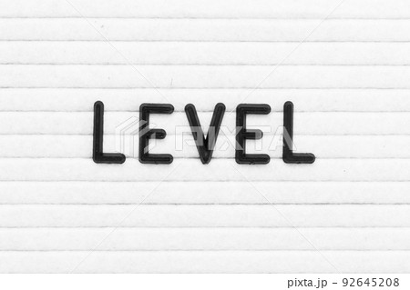 Black color letter in word level on white felt board background Black color letter in word level on white felt board background 92645208