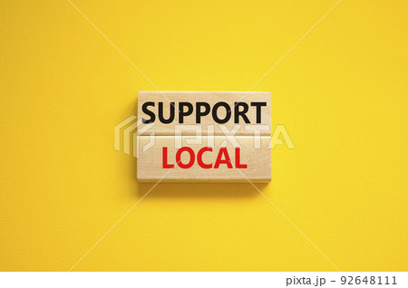 Time to support local symbol. Wooden blocks with words 'Support local'. Beautiful yellow background. Business and time to support local concept. Copy space. 92648111
