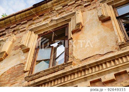 ruins. an old ruined building. broken glass in the windows. 92649355