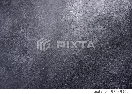 Texture of a concrete wall with cracks and scratches which can be used as a background Texture of a concrete wall with cracks and scratches which can be used as a background 92649362