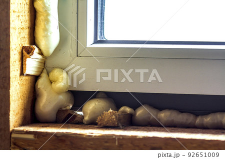 Close-up of new window installation with foam 92651009