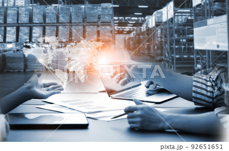 Businessman control virtual interface panel of global logistics network distribution and transportation, Smart logistics, Innovation future of transport on large warehouse center background. Businessman control virtual interface panel of global logistics network distribution and transportation, Smart logistics, Innovation future of transport on large warehouse center background. 92651651