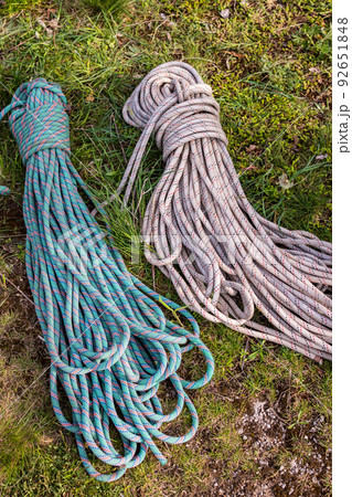 Polyamide fibres safety climbing ropes, mountain climbing equipment on a ground Polyamide fibres safety climbing ropes, mountain climbing equipment on a ground 92651848