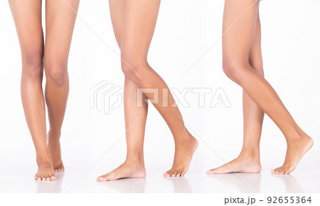 Tanned skin Woman show legs knee bare foots toe, walking forward side, white background isolated Tanned skin Woman show legs knee bare foots toe, walking forward side, white background isolated 92655364