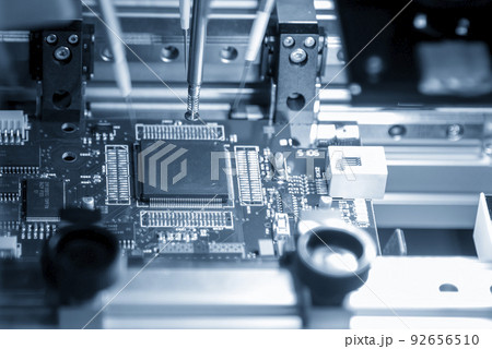 Close up scene the automatic assembly line of the main board by high speed robotic system. Close up scene the automatic assembly line of the main board by high speed robotic system. 92656510