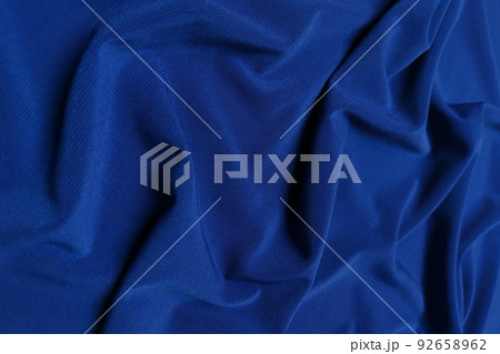 Blue crepe satin crumpled or wavy fabric texture background. Abstract linen cloth soft waves. Silk fabric. Smooth elegant luxury cloth texture. Concept for banner or advertisement. Blue crepe satin crumpled or wavy fabric texture background. Abstract linen cloth soft waves. Silk fabric. Smooth elegant luxury cloth texture. Concept for banner or advertisement. 92658962
