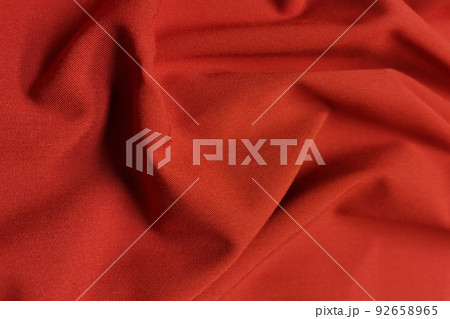 Red galliano fabric crumpled or wavy fabric texture background. Abstract linen cloth soft waves. Viscose yarn. Smooth elegant luxury cloth texture. Concept for banner or advertisement. 92658965