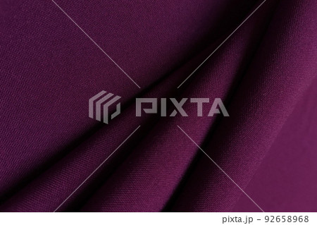 Purple crumpled or wavy fabric texture background. Abstract linen cloth soft waves. Gabardine wool fabric. Merino yarn. Smooth elegant luxury cloth texture. Concept for banner or advertisement. 92658968