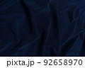 Blue crepe satin crumpled or wavy fabric texture background. Abstract linen cloth soft waves. Silk fabric. Smooth elegant luxury cloth texture. Concept for banner or advertisement. 92658970