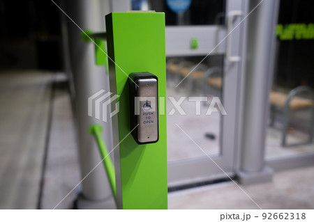 Push to open button for wheelchair users of the bus waiting pavilion. Push to open button for wheelchair users of the bus waiting pavilion. 92662318