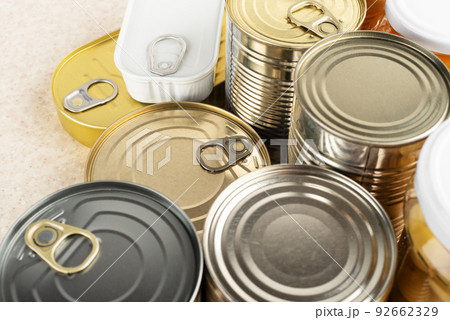 Tin cans on kitchen table background with copy space Tin cans on kitchen table background with copy space 92662329
