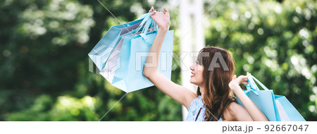 Beautiful smile asian young woman shopping Beautiful smile asian young woman shopping 92667047