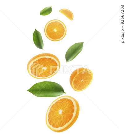 Falling juicy oranges with green leaves isolated on transparent background. Flying defocusing slices of oranges. Applicable for fruit juice advertising Falling juicy oranges with green leaves isolated on transparent background. Flying defocusing slices of oranges. Applicable for fruit juice advertising 92667203