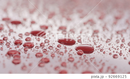 water beading on red car with hydrophobic coating water beading on red car with hydrophobic coating 92669125