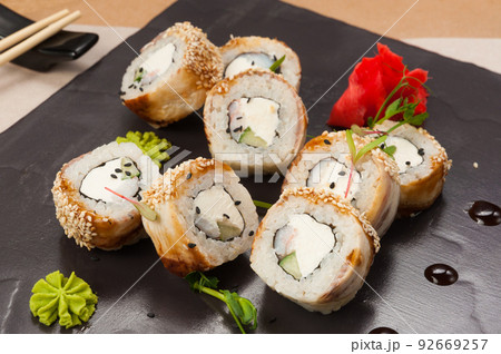 sushi rolls with shrimp, cucumber cream cheese and eel 92669257