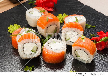 sushi rolls with salmon, cucumber and cream cheese. close-up sushi rolls with salmon, cucumber and cream cheese. close-up 92669258
