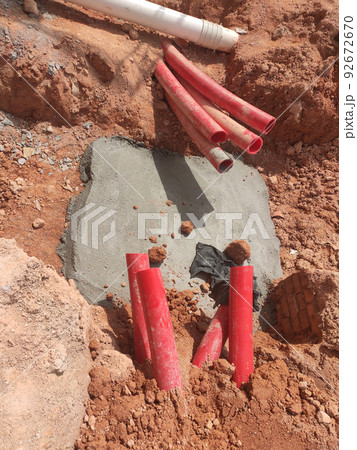 SELANGOR, MALAYSIA -AUGUST 2, 2021: Heavy-duty underground pipes lay in the ground at a construction site. this pipe will be the path to the high voltage electric cable. 92672670