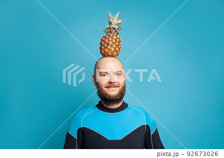Man with pineapple. Adventure, discovery, navigation and travel theme concept 92673026