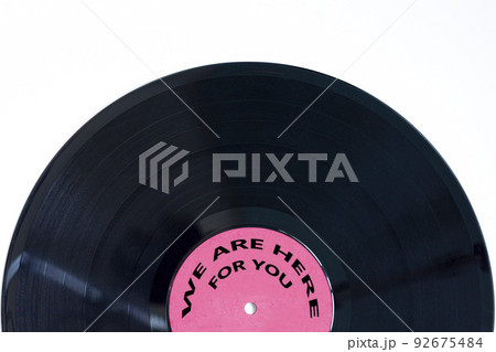 Support symbol. Concept words We are here for you on retro black vinyl disc. Beautiful white background, copy space. Business and support concept. Support symbol. Concept words We are here for you on retro black vinyl disc. Beautiful white background, copy space. Business and support concept. 92675484