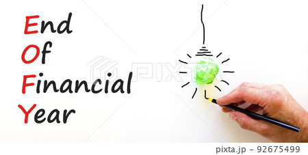 EOFY end of financial year symbol. Concept words EOFY end of financial year on white paper on beautiful white background. Black calculator and pen. Business and EOFY end of financial year concept. 92675499