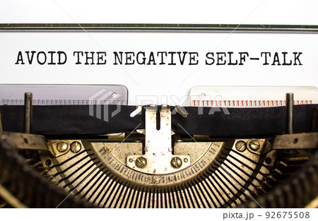 Avoid negative self-talk symbol. Concept words Avoid the negative self-talk typed on old retro typewriter. Beautiful white background. Psychological and Avoid negative self-talk concept. Copy space. 92675508