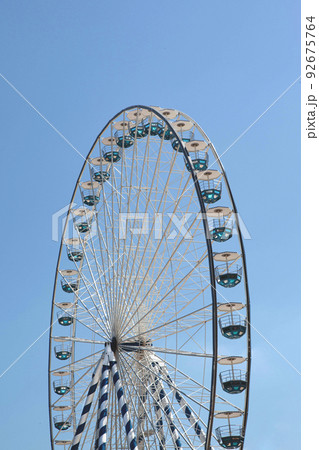 Big wheel and blue sky on background 92675764