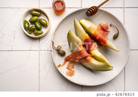 Jamon or prosciutto with melon Jamon or prosciutto with melon 92676915