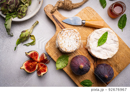 Brie or camembert cheese with figs Brie or camembert cheese with figs 92676967
