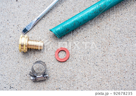 new garden hose replacement connection and pipe mender to tighten and secure repair. new garden hose replacement connection and pipe mender to tighten and secure repair. 92678235