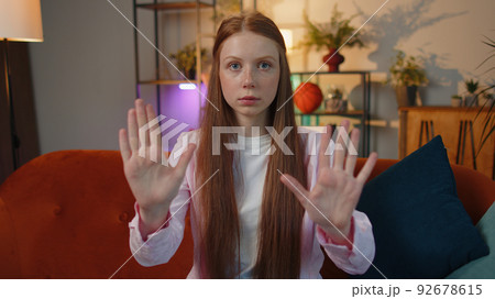Angry girl say No hold palm folded crossed hands, warning of finish, Stop gesture, declining talk 92678615