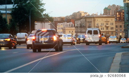 Moscow centre cityscape behind blurred road traffic in the evening Moscow centre cityscape behind blurred road traffic in the evening 92680068