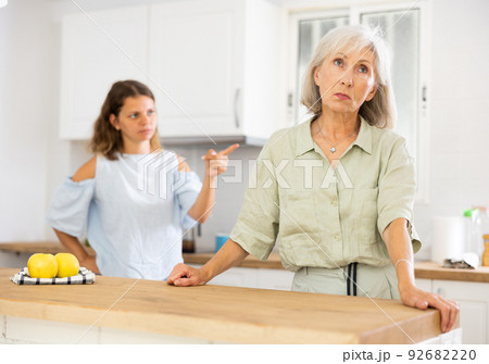Sad senior woman ignoring her daughter arguing with her 92682220