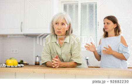 Sad senior woman ignoring her daughter arguing with her 92682230