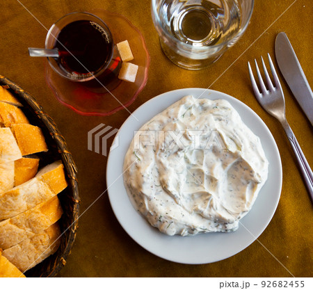 Turkish cacik from yogurt with crushed garlic, cucumber and greens Turkish cacik from yogurt with crushed garlic, cucumber and greens 92682455