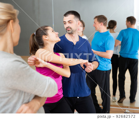 People dancing social dances in pair People dancing social dances in pair 92682572