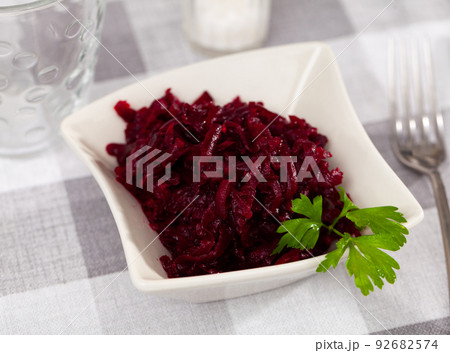 Popular russian salad, made from boiled grated beetroot, decorated with herbs Popular russian salad, made from boiled grated beetroot, decorated with herbs 92682574