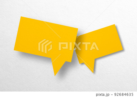 Speech balloon shaped yellow paper isolated on white background. 92684635