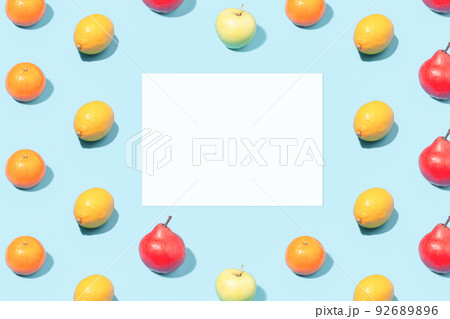 Creative summer mockup - blank white leaf on ripe fruit background Creative summer mockup - blank white leaf on ripe fruit background 92689896