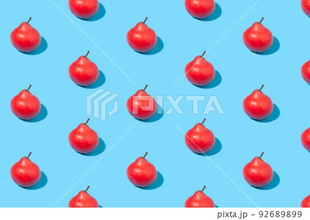 Red ripe pears on a blue background 92689899