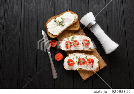 Toasts with microgreens on the table. Healthy food, vegan food and dieting concept. 92692316