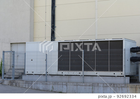Large industrial air conditioner on the side of the mall. Large industrial air conditioner on the side of the mall. 92692334