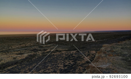 Panorama view to Aral sea from the rim of Plateau Ustyurt near Aktumsuk cape at sunset, Karakalpakstan, Uzbekistan Panorama view to Aral sea from the rim of Plateau Ustyurt near Aktumsuk cape at sunset, Karakalpakstan, Uzbekistan 92693100