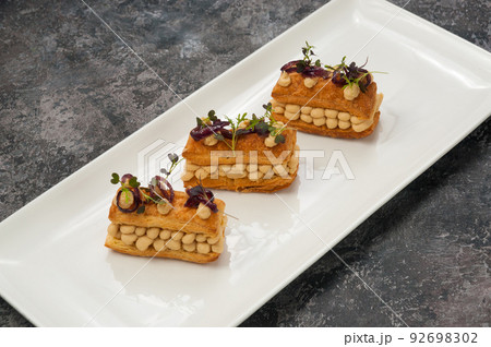 puff pastry appetizer with chicken pate and caramelized onions puff pastry appetizer with chicken pate and caramelized onions 92698302