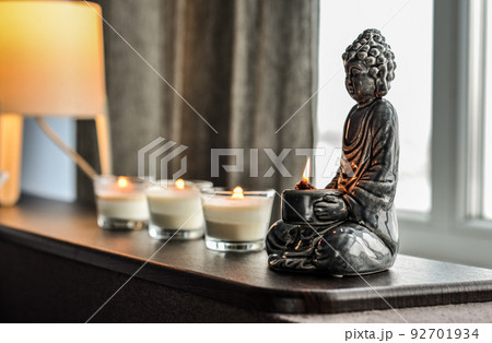 Candlestick in the shape of a buddha Candlestick in the shape of a buddha 92701934
