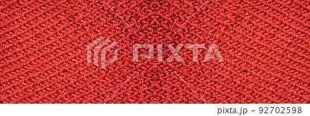 Handmade knitted fabric red wool background texture Handmade knitted fabric red wool background texture 92702598
