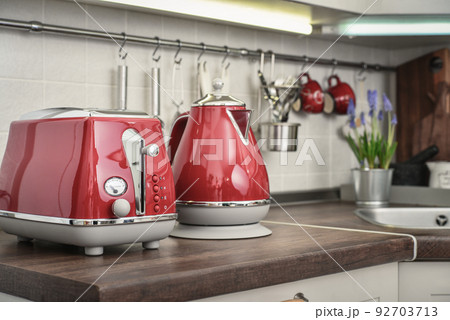 Red toaster and electric kettle in retro slile 92703713