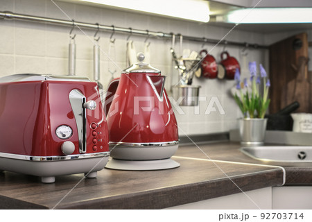 Red toaster and electric kettle in retro slile 92703714